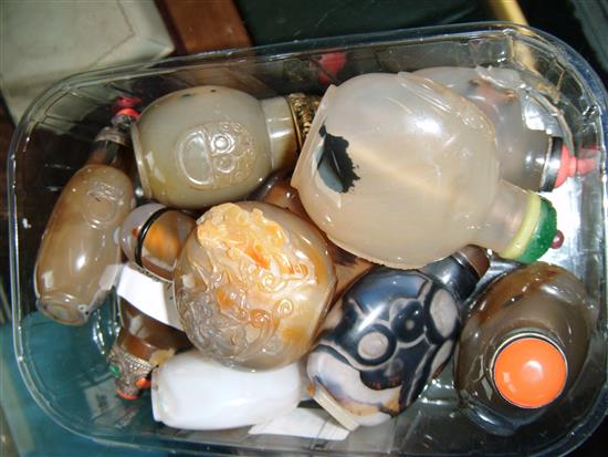 Ten Chinese agate and chalcedony snuff bottles, three with coral mounted stoppers,